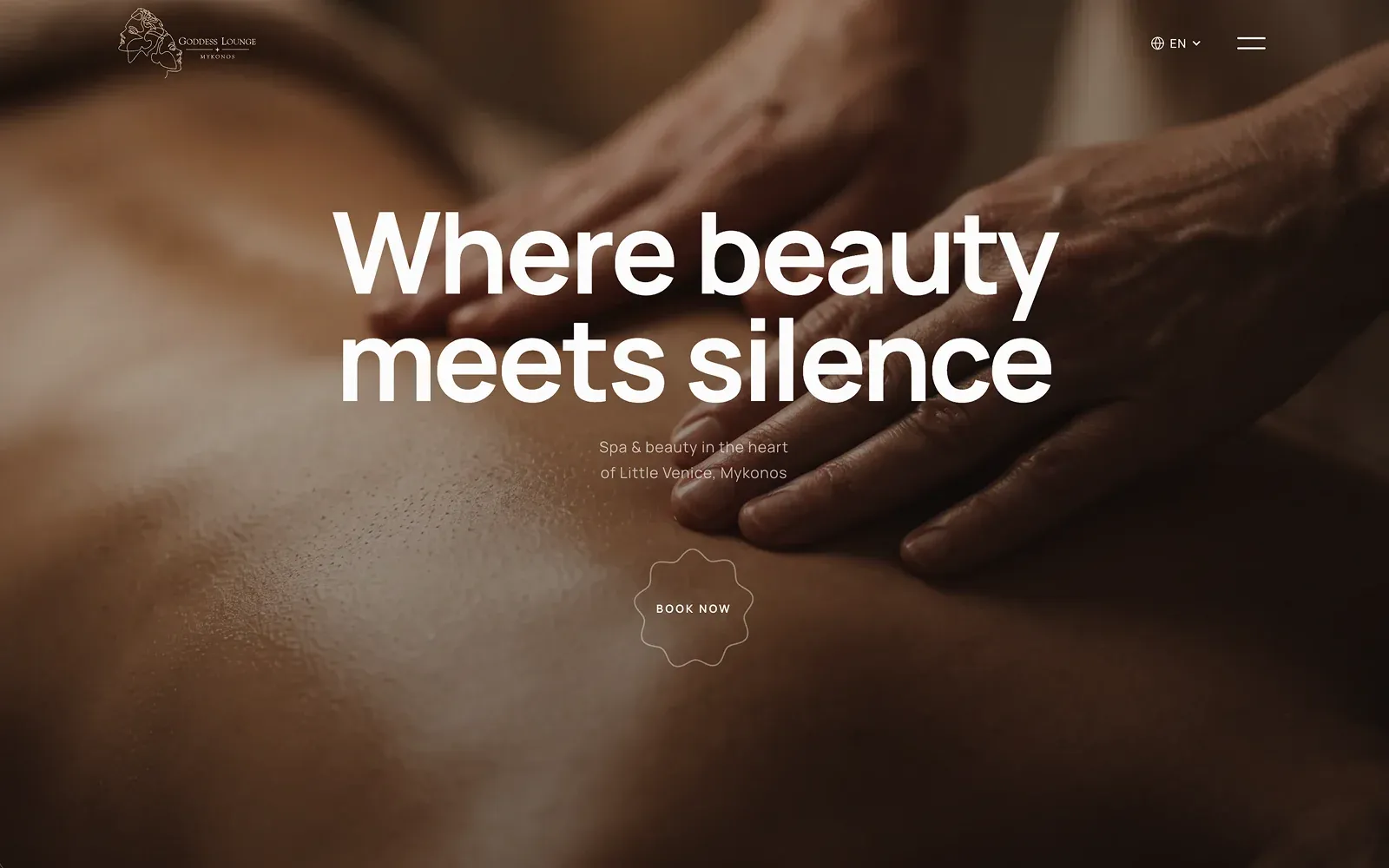 The Goddess Lounge Mykonos homepage — a centred headline over a warm, close-up massage photograph